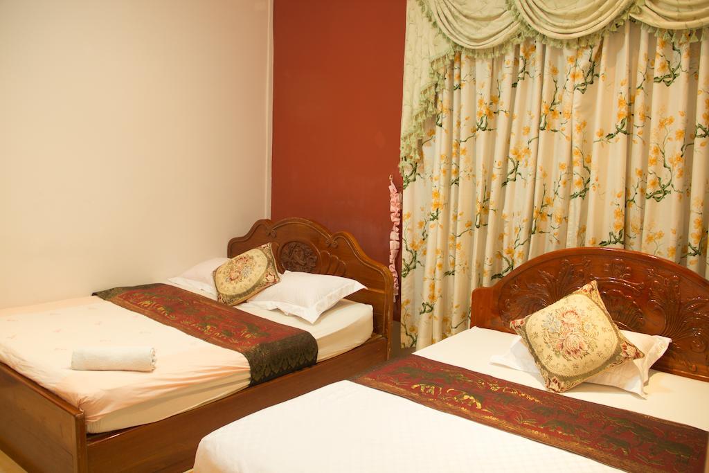 Royal pensión Phnom Penh Habitación foto